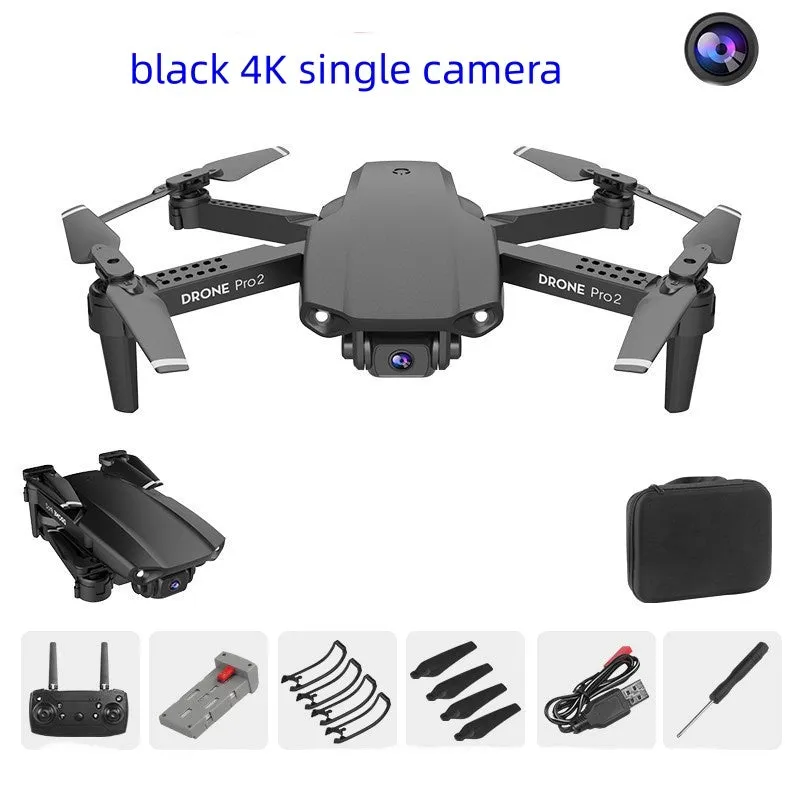 E99Pro2 folding dual camera drone black with propellers on table