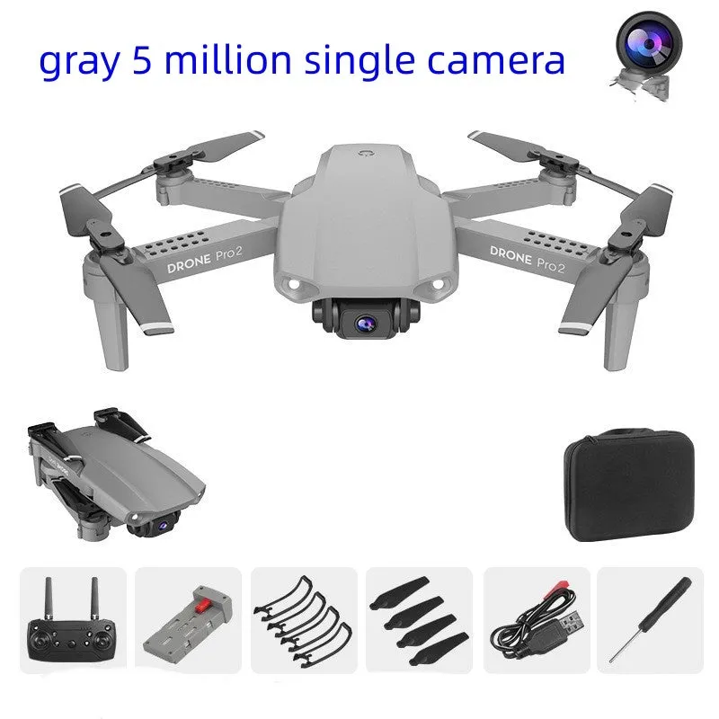 E99Pro2 folding dual camera drone black with propellers on table