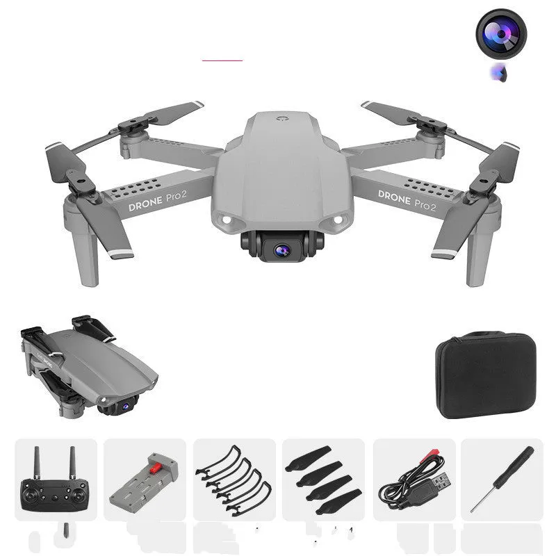 E99Pro2 folding dual camera drone black with propellers on table
