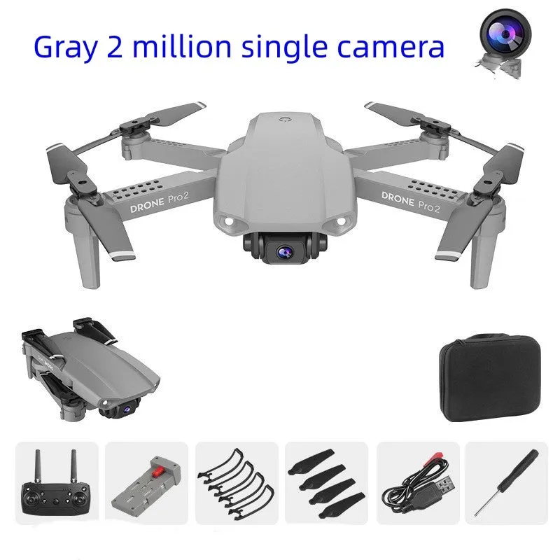 E99Pro2 folding dual camera drone black with propellers on table