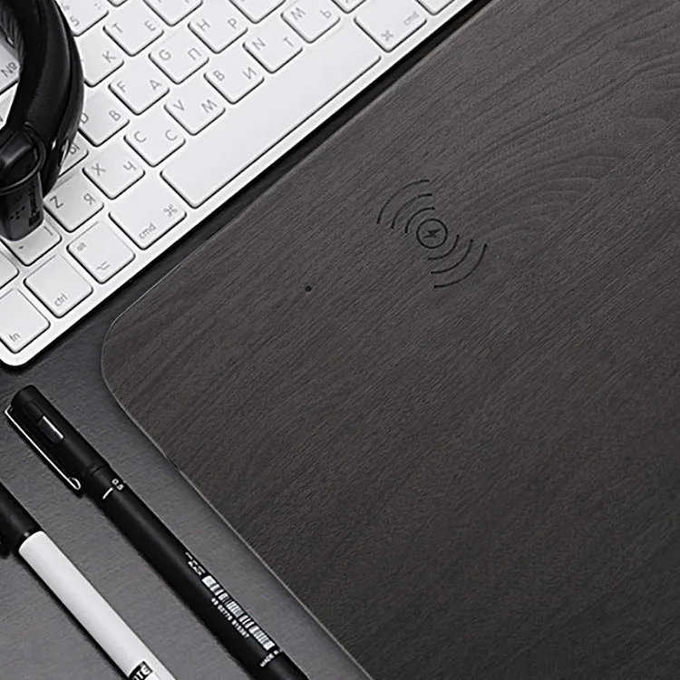 Wooden wireless charger with PU leather surface in brown finish on a desk