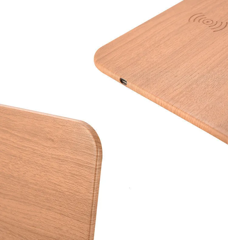 Wooden wireless charger with PU leather surface in brown finish on a desk