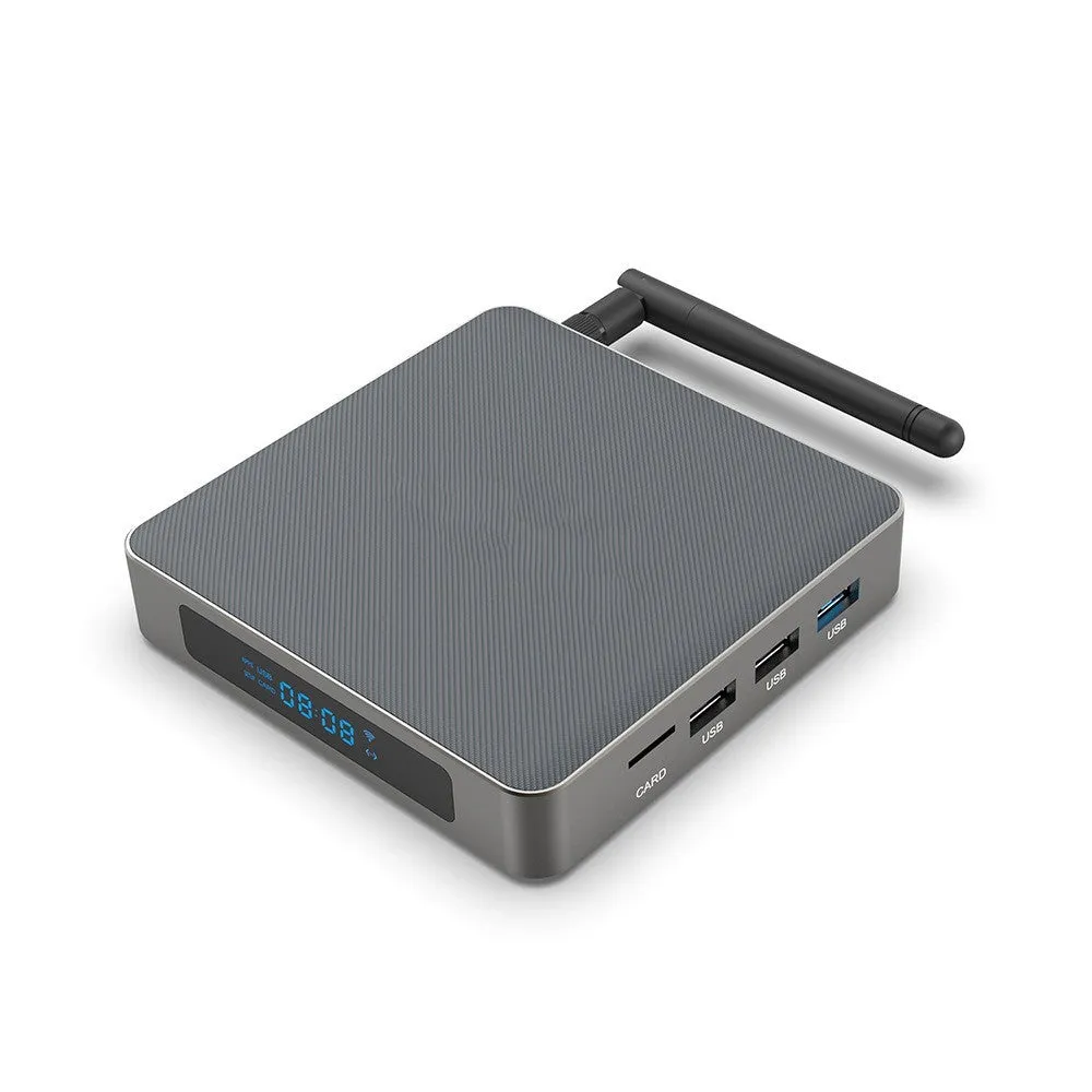 Black Android TV set-top box with HDMI port and remote control on a wooden surface.