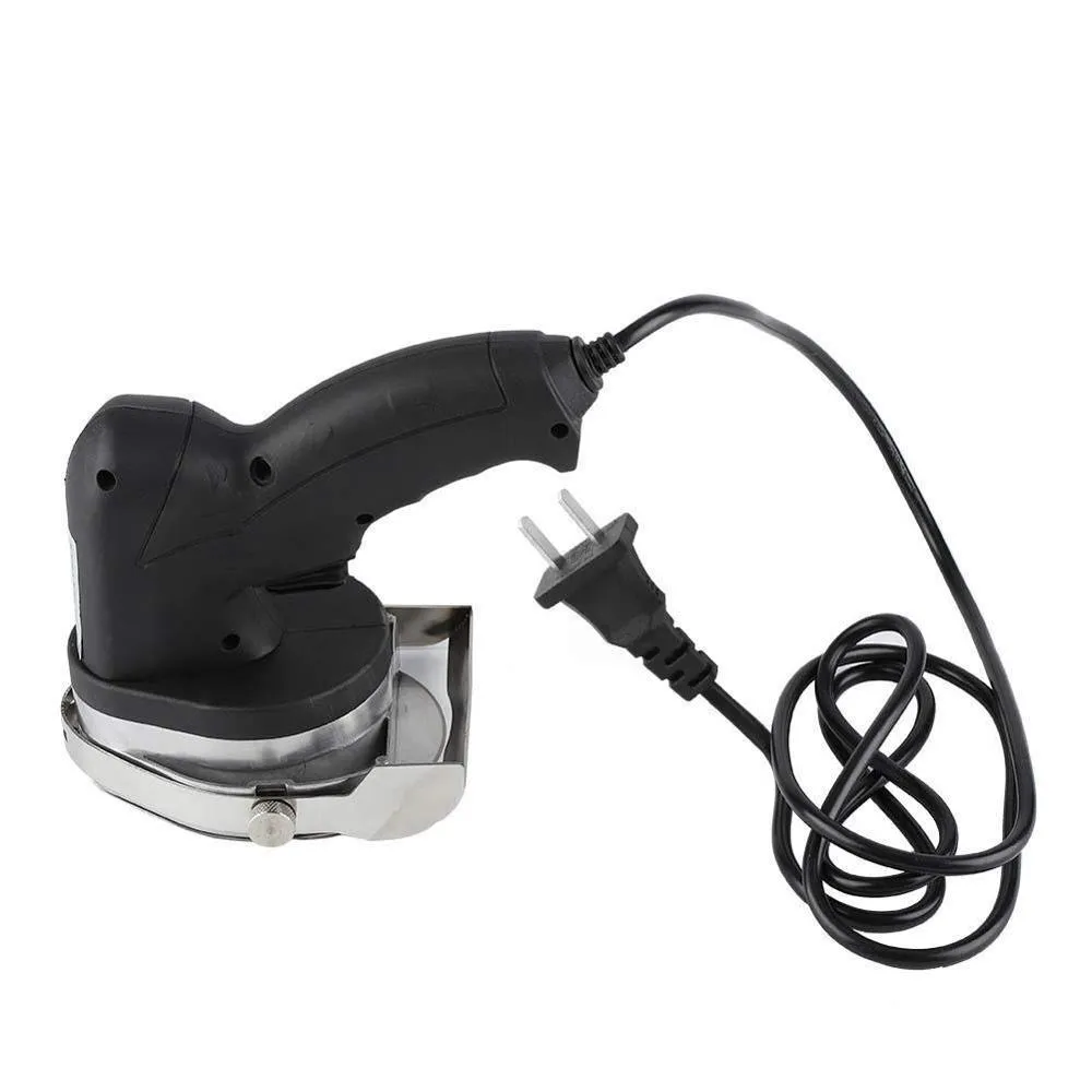 Black KS-100E electric meat cleaver with thickness adjustment dial for turkey and barbecue prep.