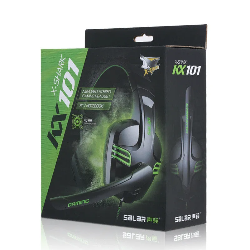Black wired gaming headset with microphone placed on a desk, 3.5mm plug visible