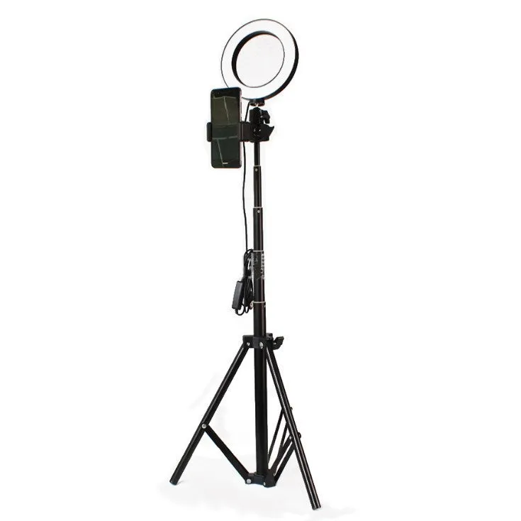 26cm RGB ring light set with tripod, selfie stick, and Bluetooth remote on a desk