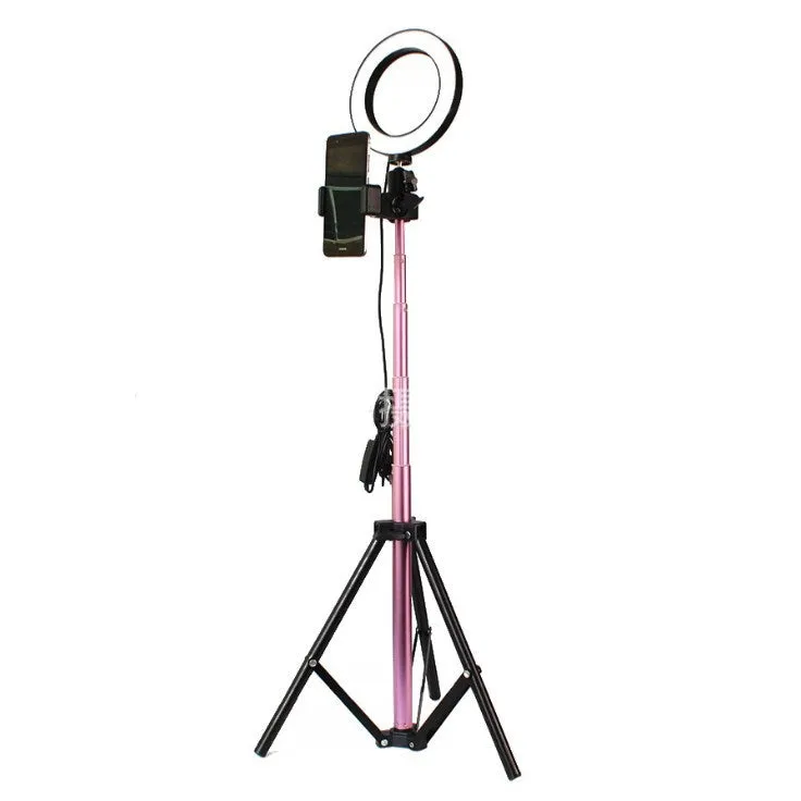 26cm RGB ring light set with tripod, selfie stick, and Bluetooth remote on a desk