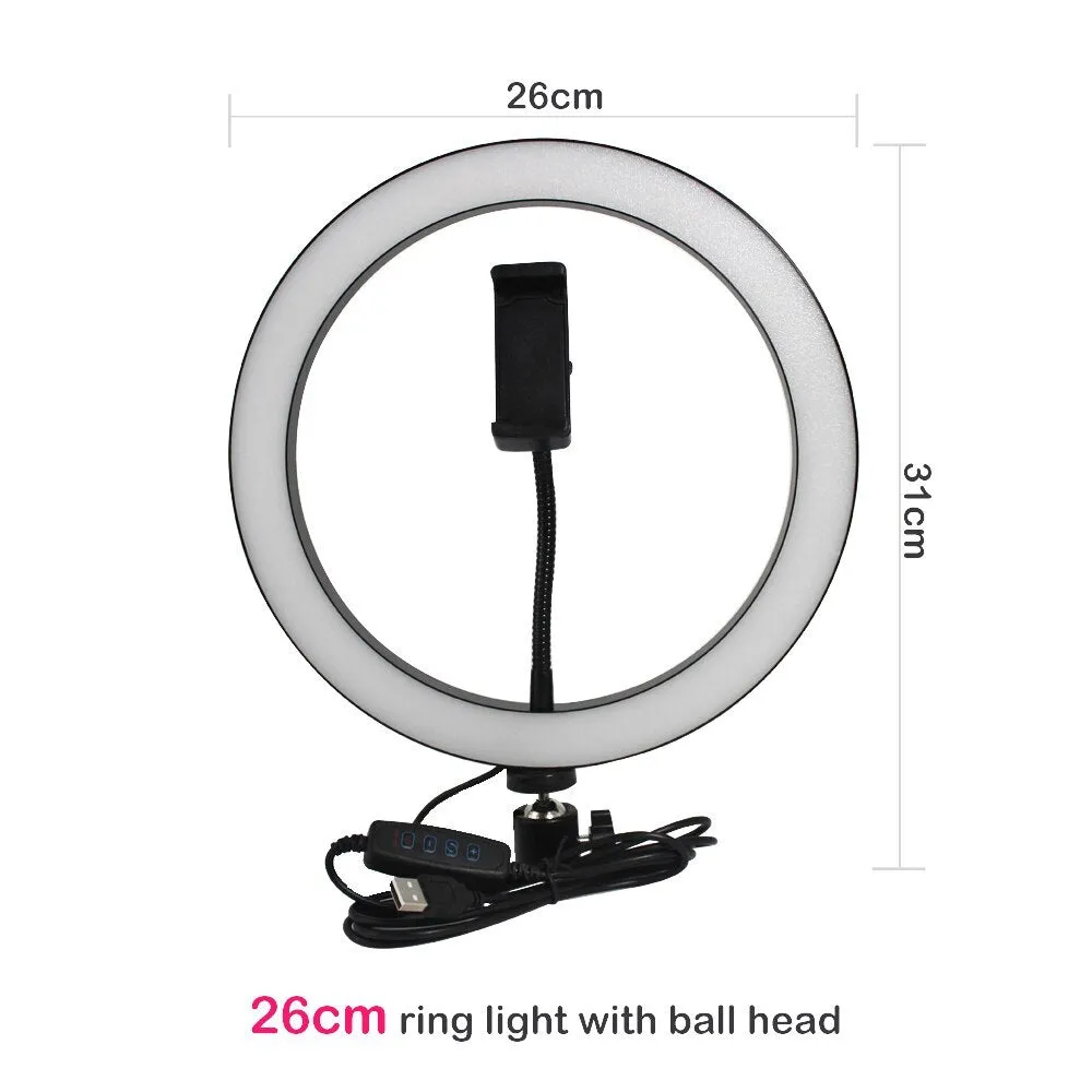26cm RGB ring light set with tripod, selfie stick, and Bluetooth remote on a desk