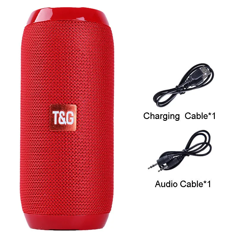 Black portable IPX5 waterproof Bluetooth speaker with mesh grille on a rocky outdoor surface