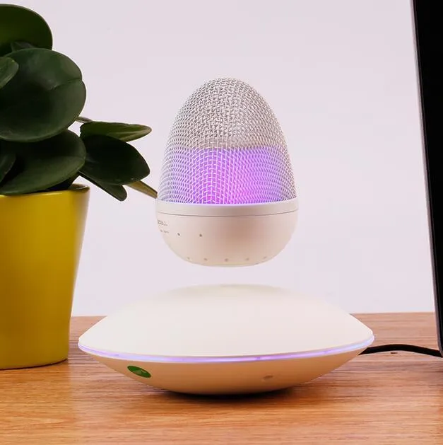 Levitating floating speaker with magnetic suspension, cast FRP body, black colour, hovering above base on a desk