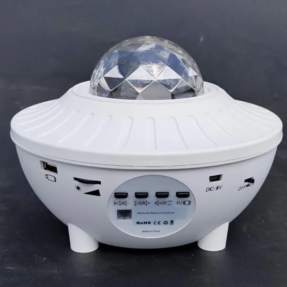 LED Bluetooth music projector light with starry sky effect, green laser, remote control, and USB cable
