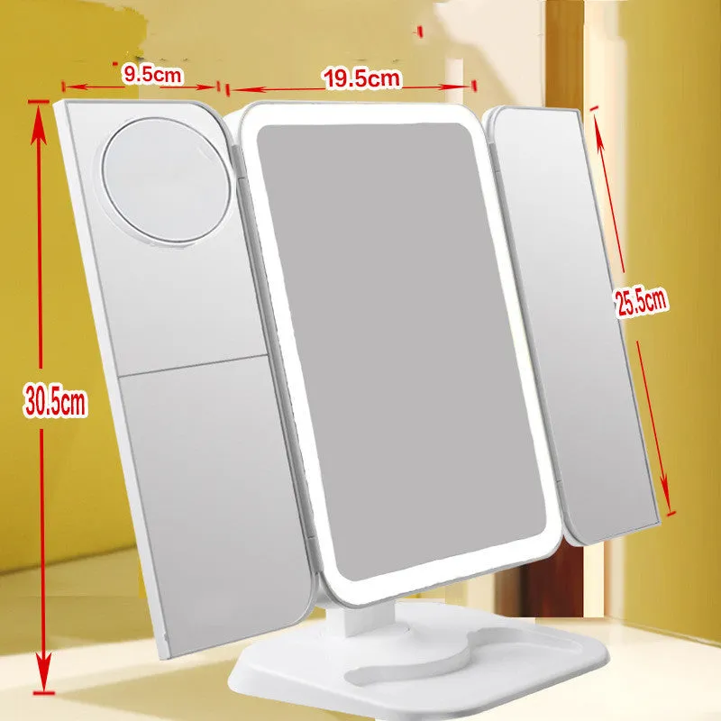 Trifold LED makeup mirror with 68 lights, 10X detachable magnifier, silver surface, rotating 180 degrees on a tabletop