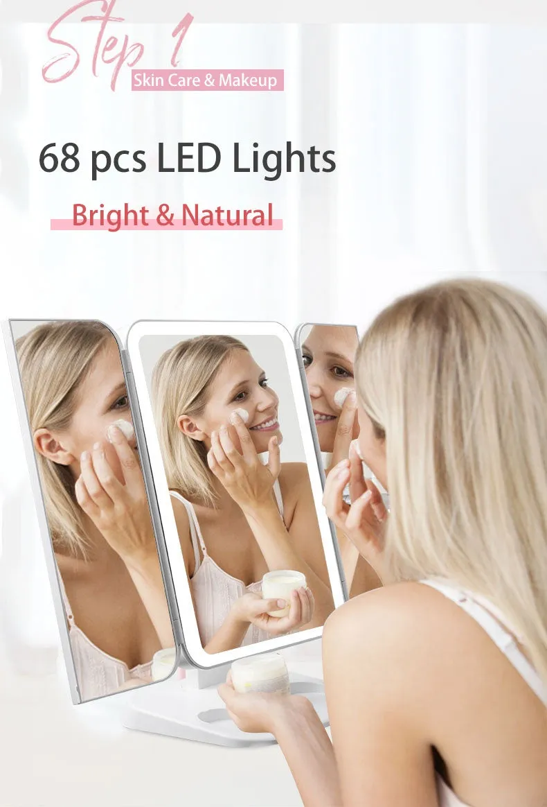 Trifold LED makeup mirror with 68 lights, 10X detachable magnifier, silver surface, rotating 180 degrees on a tabletop