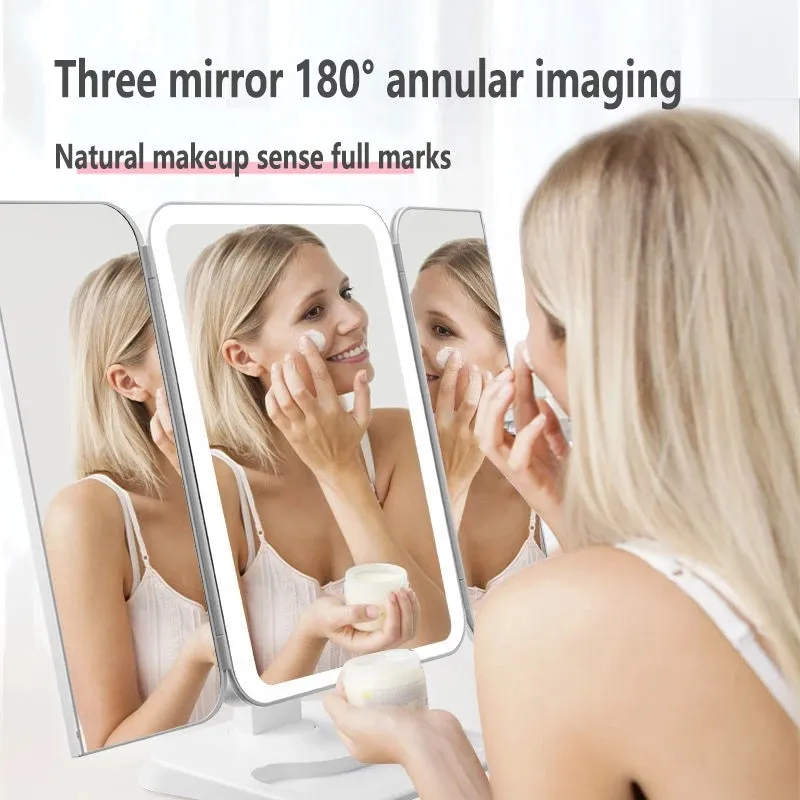 Trifold LED makeup mirror with 68 lights, 10X detachable magnifier, silver surface, rotating 180 degrees on a tabletop