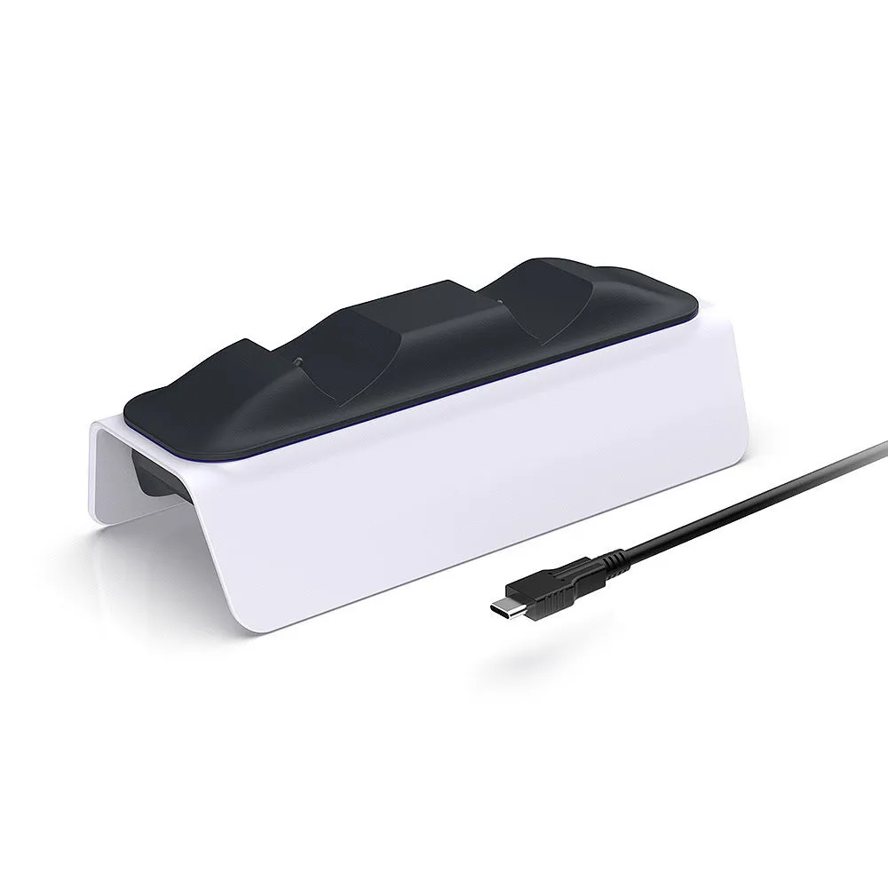 White PS5 dual controller charger with LED indicators and two gamepads docked on a wooden desk