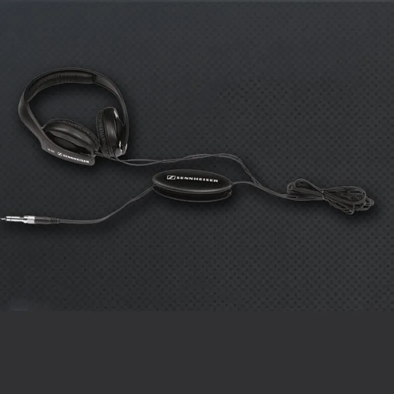 Black wired head-mounted monitor headphones with 40mm driver and 2.5m cable on a desk
