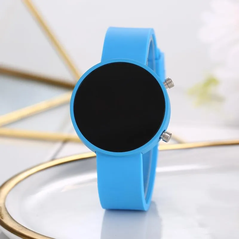 Round LED digital watch with square dial and alloy strap on wrist, showing calendar display