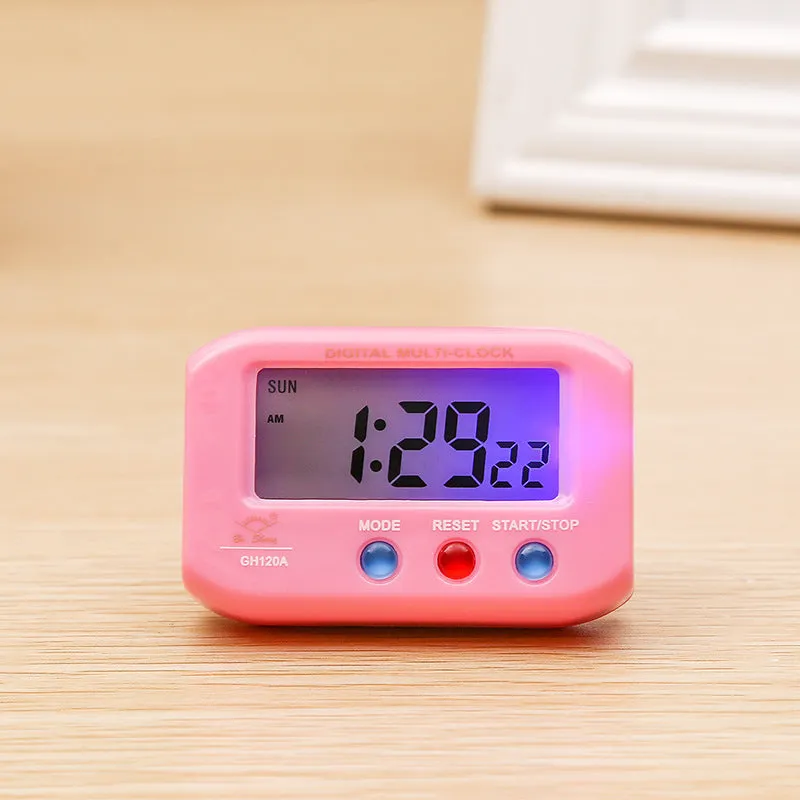 Portable LCD alarm clock with luminous display, showing time and date on screen