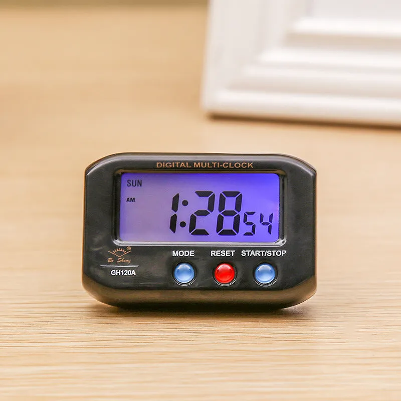 Portable LCD alarm clock with luminous display, showing time and date on screen