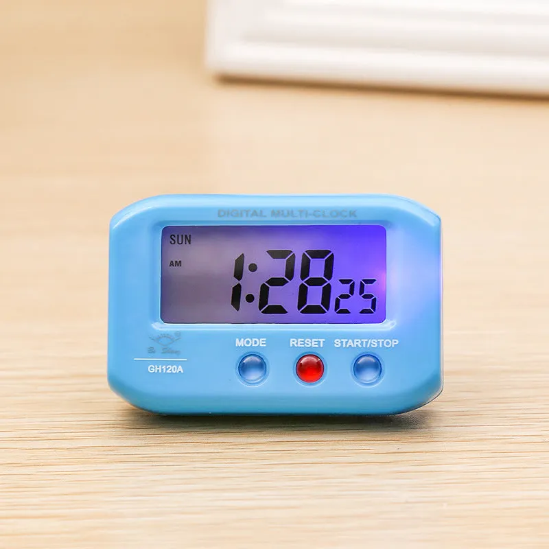 Portable LCD alarm clock with luminous display, showing time and date on screen