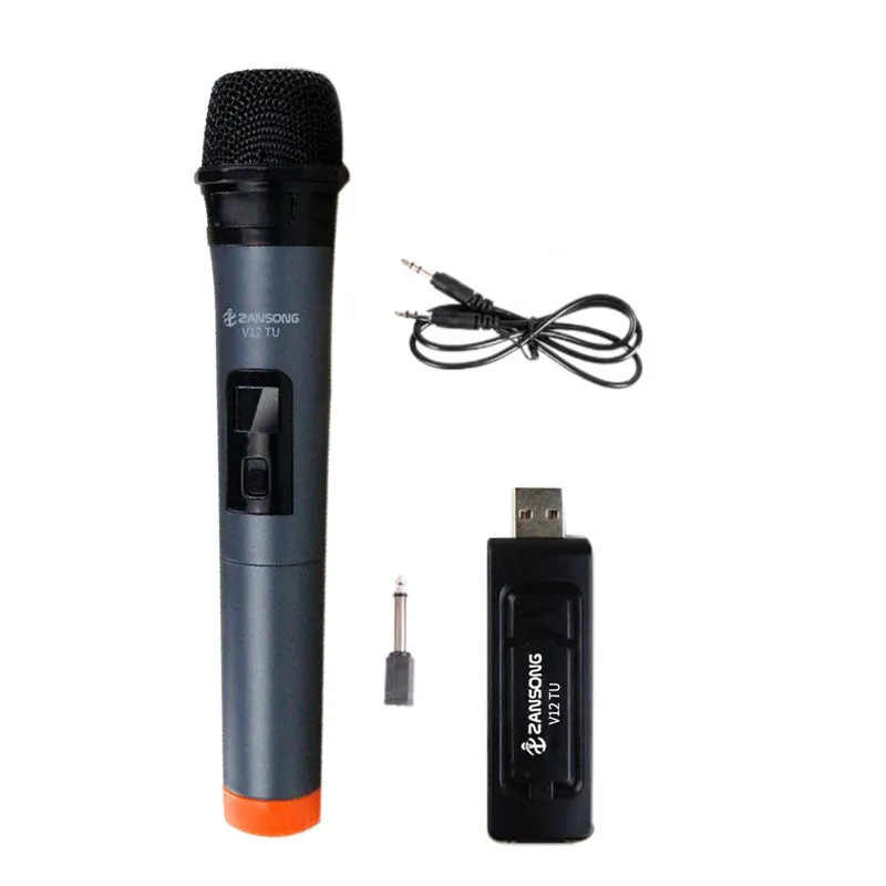 Black handheld dynamic microphone with USB receiver and cables on a table.