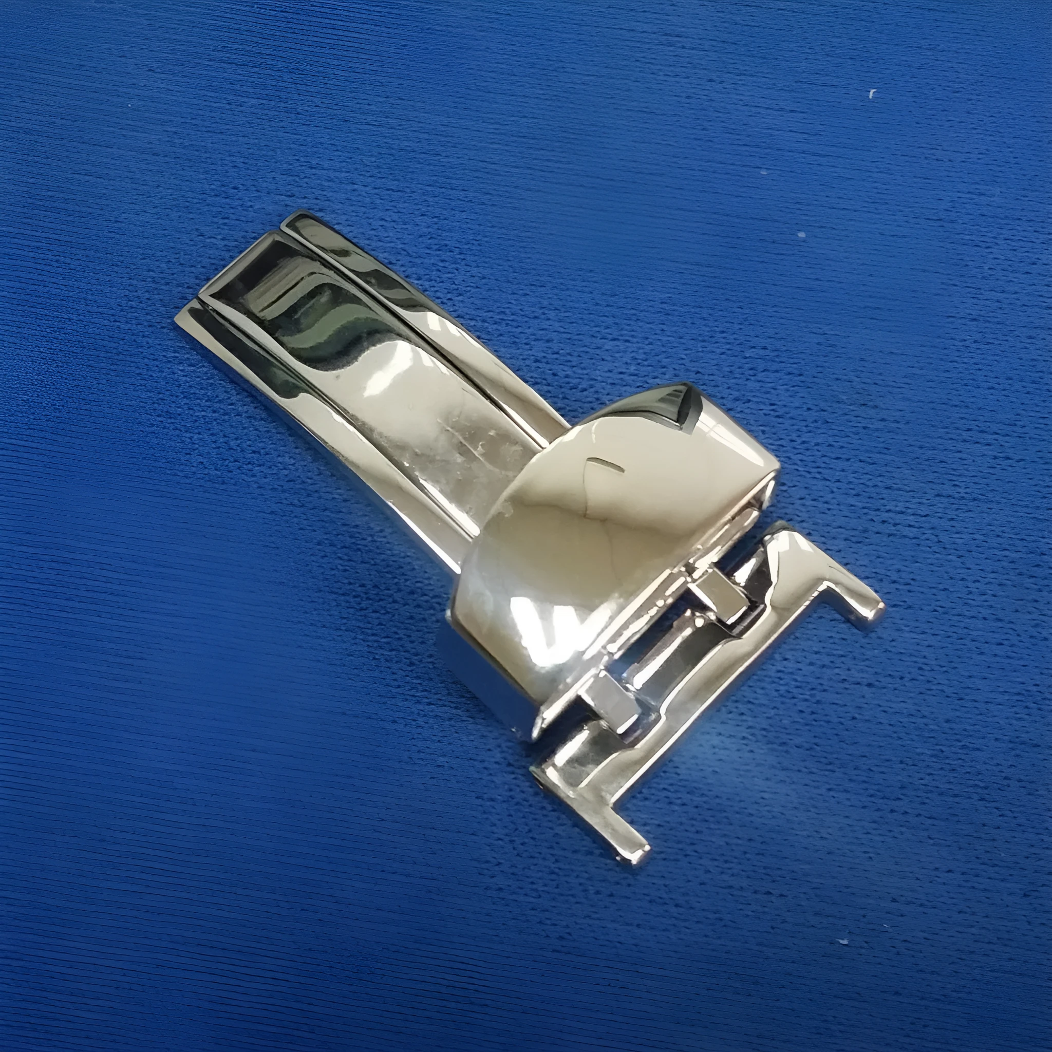 Silver stainless steel single-side folding watch buckle clasp on a white background