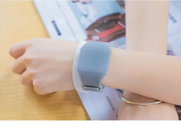 Square electronic touch screen watch with digital display on a PU strap, shown in multiple colour options.