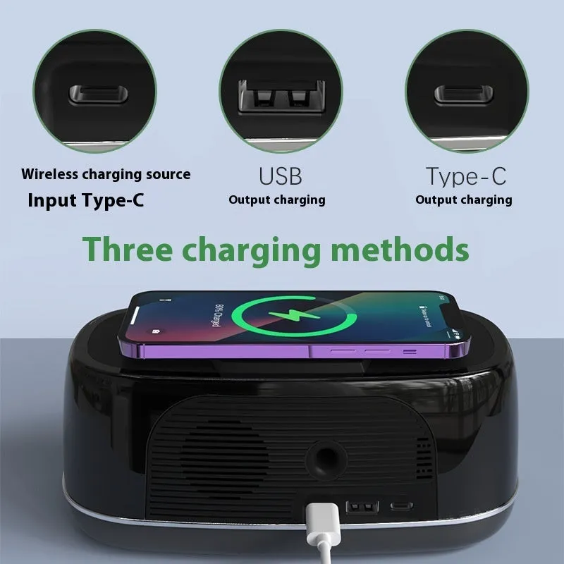 Deep black Bluetooth audio subwoofer with wireless charging pad and colourful light display