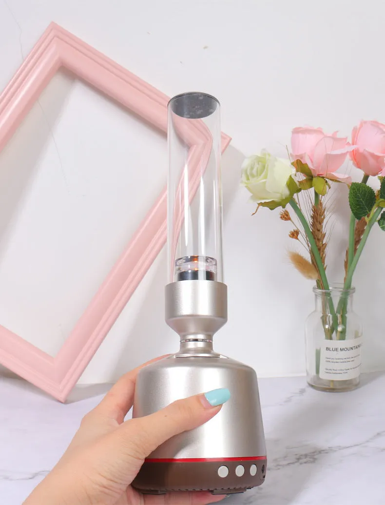 White silver Bluetooth speaker with integrated candlelight atmosphere night light.