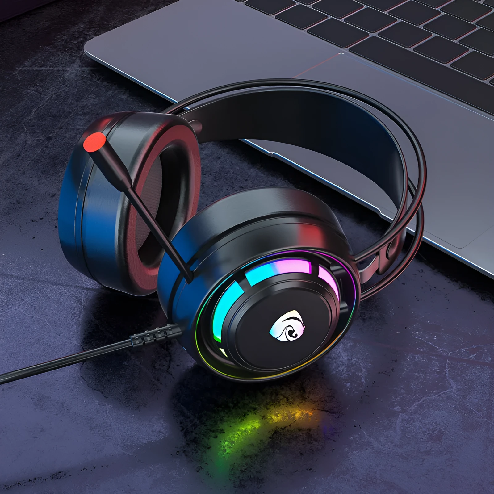 Black wired over-ear gaming headphones with microphone and a long cable, showing 3.5mm and USB plug options.