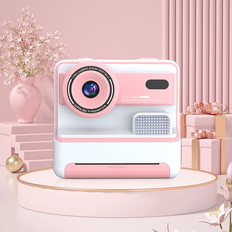 Children's dual lens printing camera in blue with ABS body, 94x56.8x89.2mm, showing front camera and lanyard