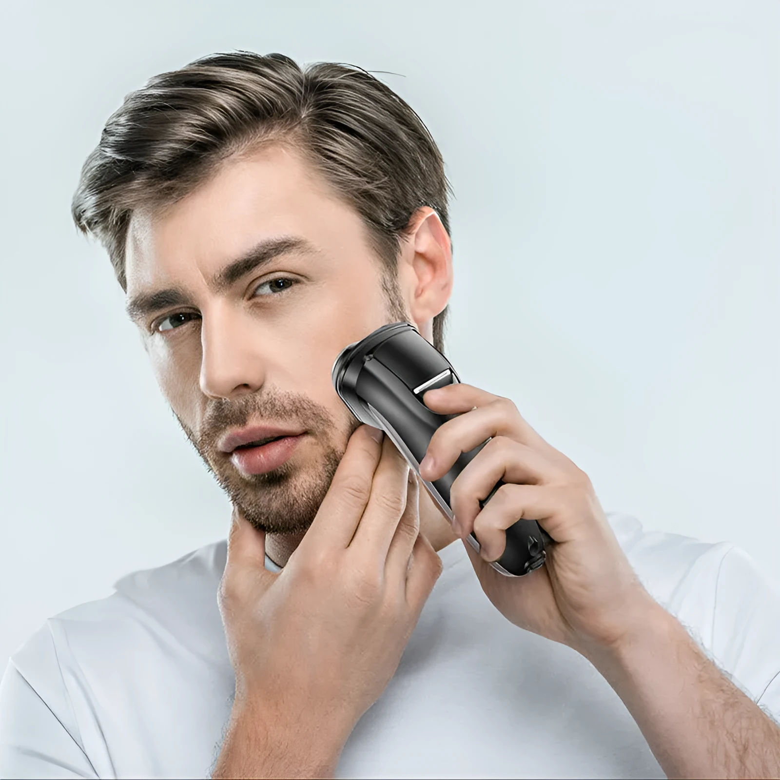Men's electric shaver with three floating heads and pop-up sideburn trimmer on black background