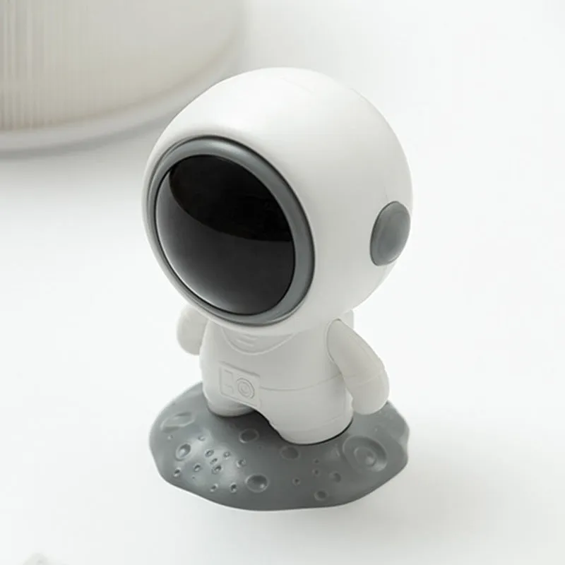Spaceman Bluetooth speaker in moon astronaut design on desktop
