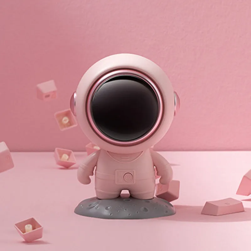 Spaceman Bluetooth speaker in moon astronaut design on desktop