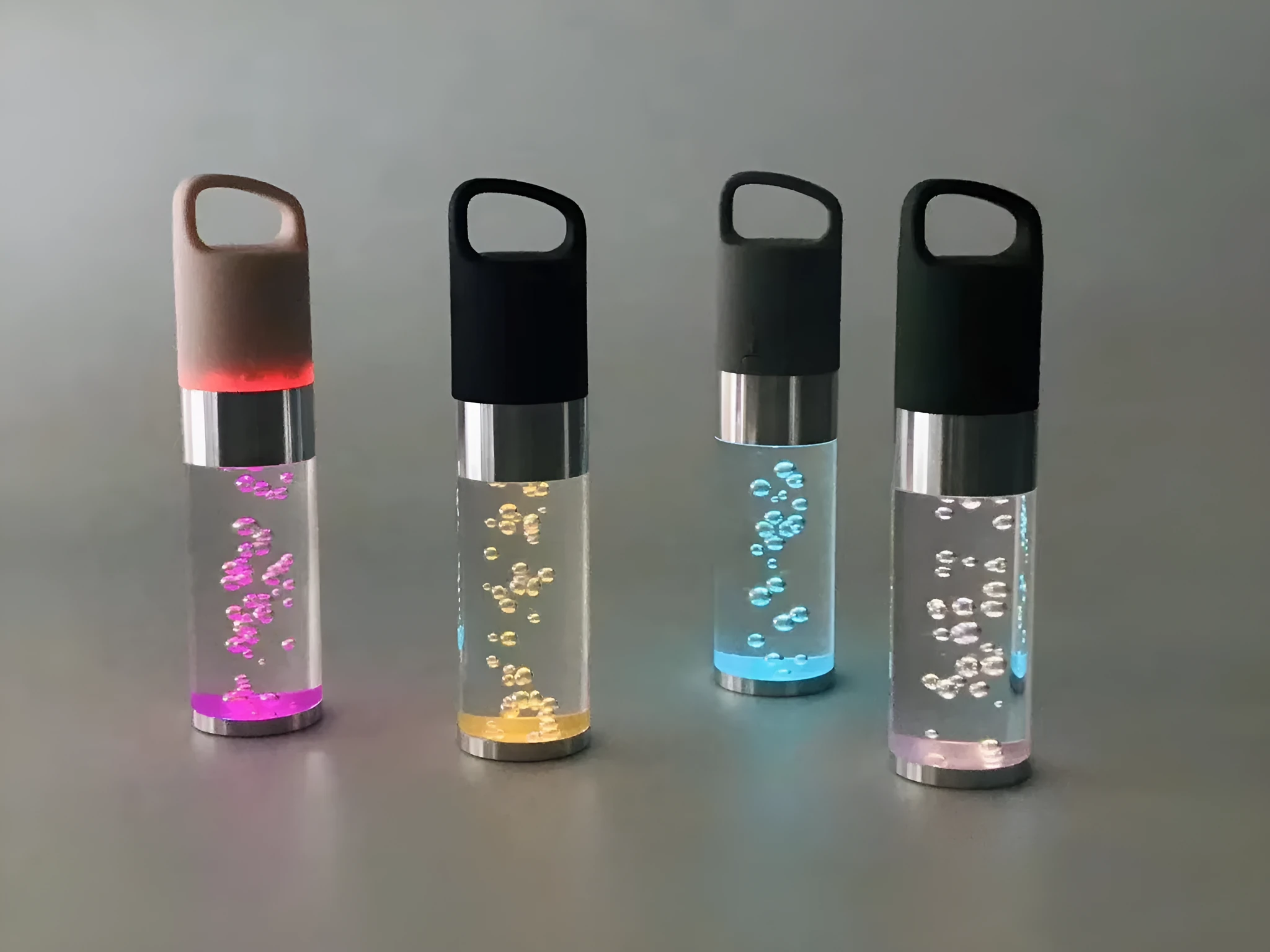 Compact pink Bluetooth speaker with colourful crystal LED lights, showing front and side.