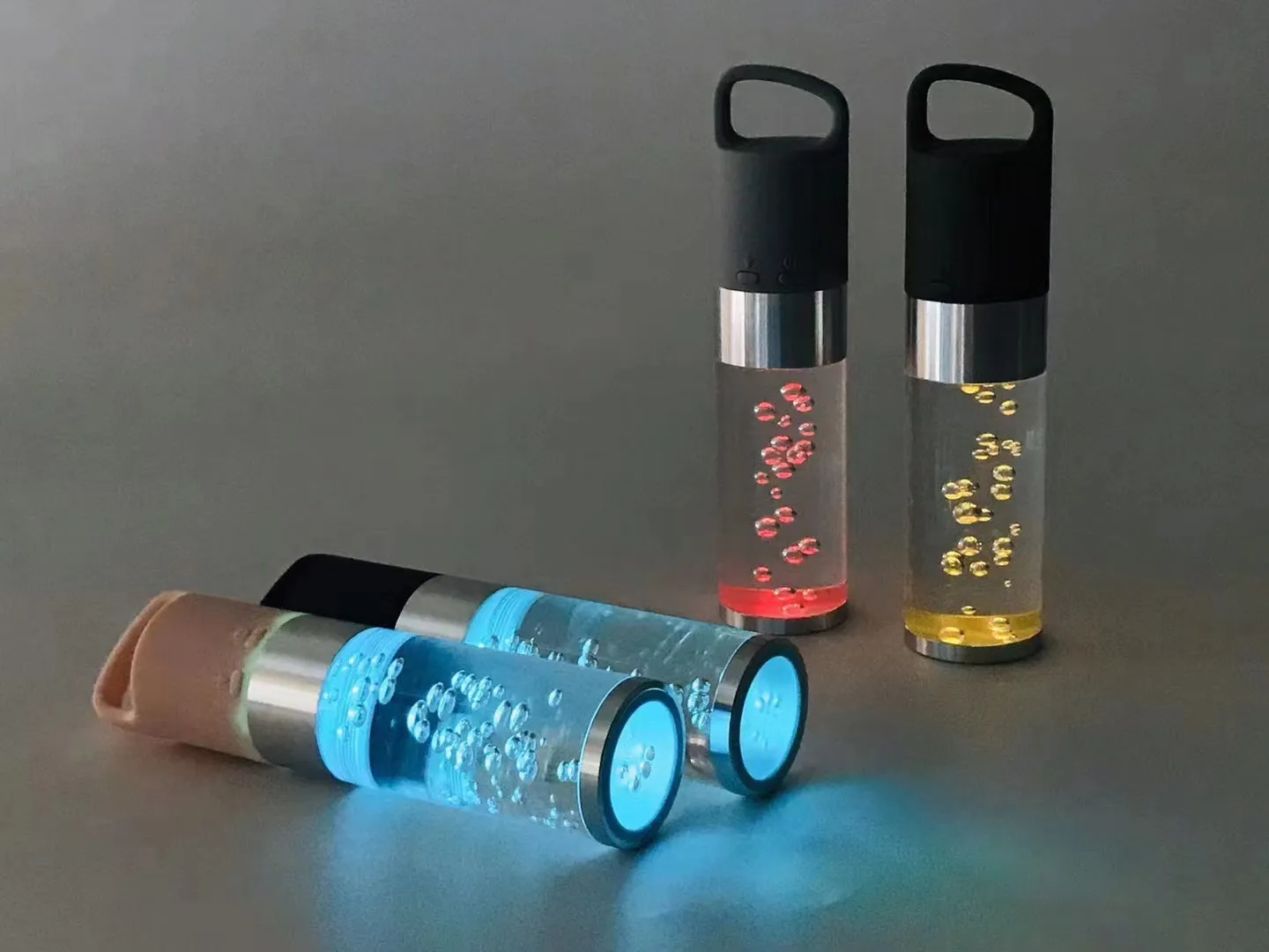 Compact pink Bluetooth speaker with colourful crystal LED lights, showing front and side.