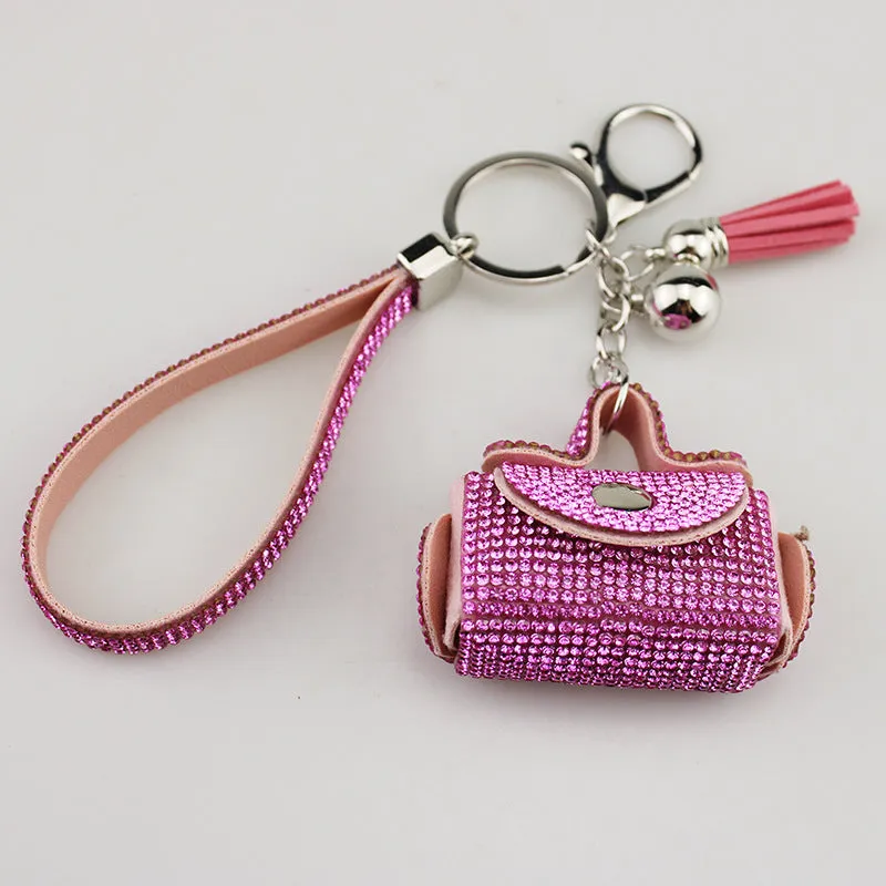 Leather diamond coin purse earphone bag in black with zip closure and keychain pendant