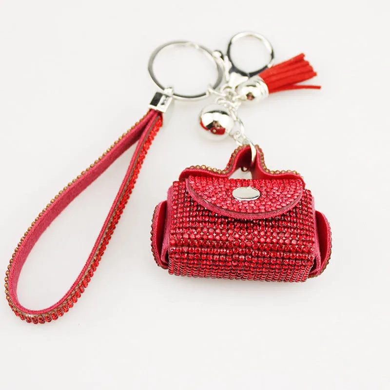 Leather diamond coin purse earphone bag in black with zip closure and keychain pendant