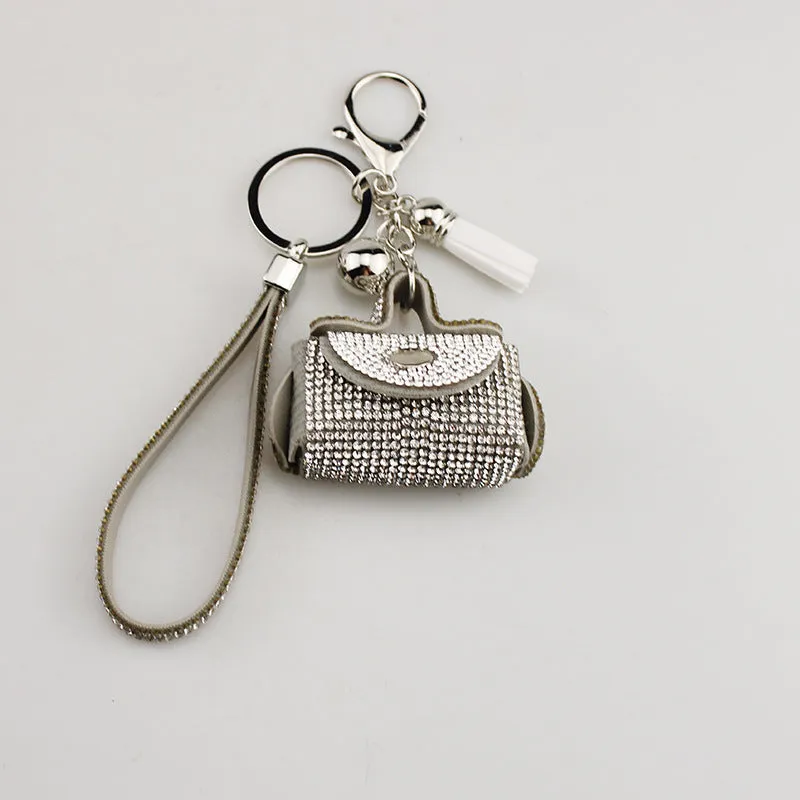 Leather diamond coin purse earphone bag in black with zip closure and keychain pendant