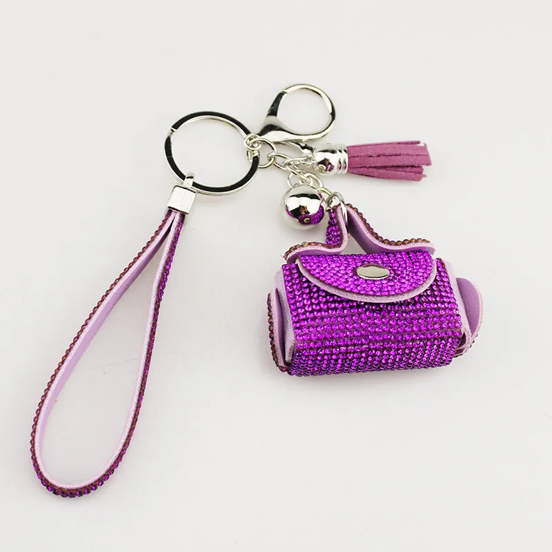 Leather diamond coin purse earphone bag in black with zip closure and keychain pendant