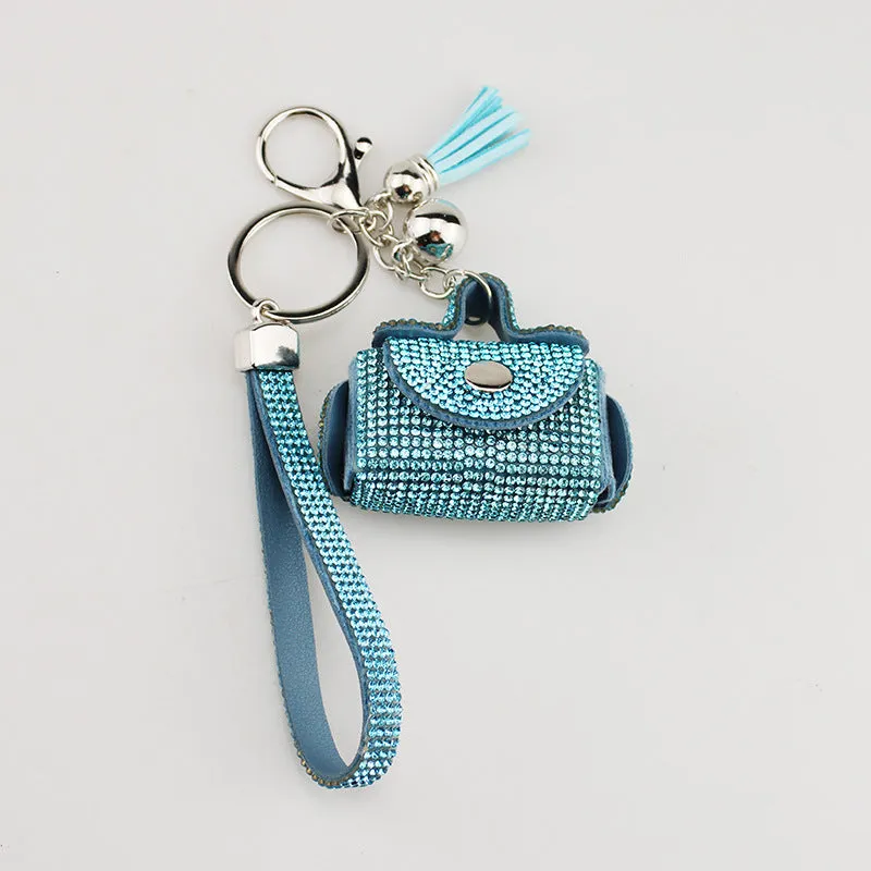 Leather diamond coin purse earphone bag in black with zip closure and keychain pendant