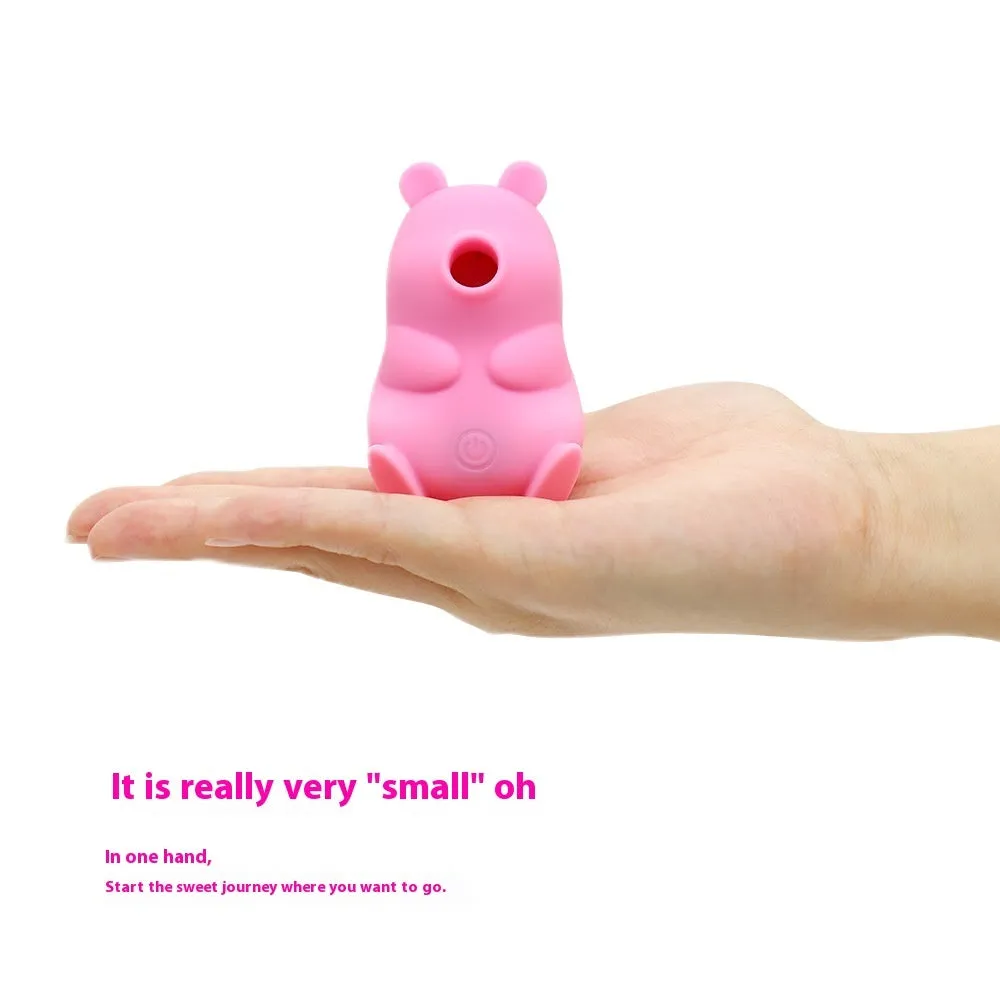 Cute bear-shaped silicone suction massage device in pink and yellow with magnetic charging cable