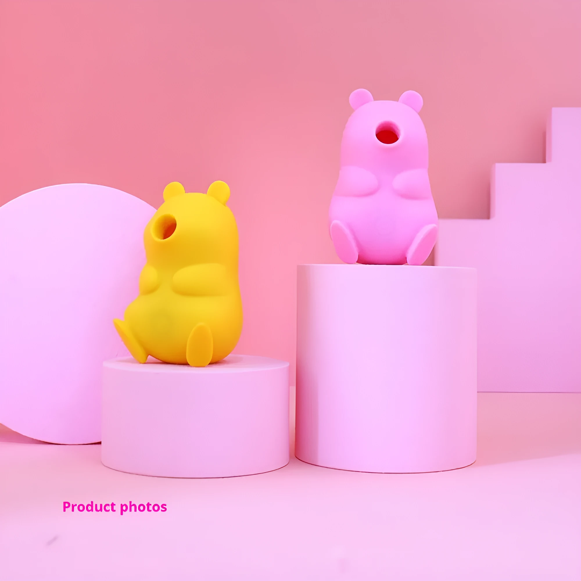Cute bear-shaped silicone suction massage device in pink and yellow with magnetic charging cable