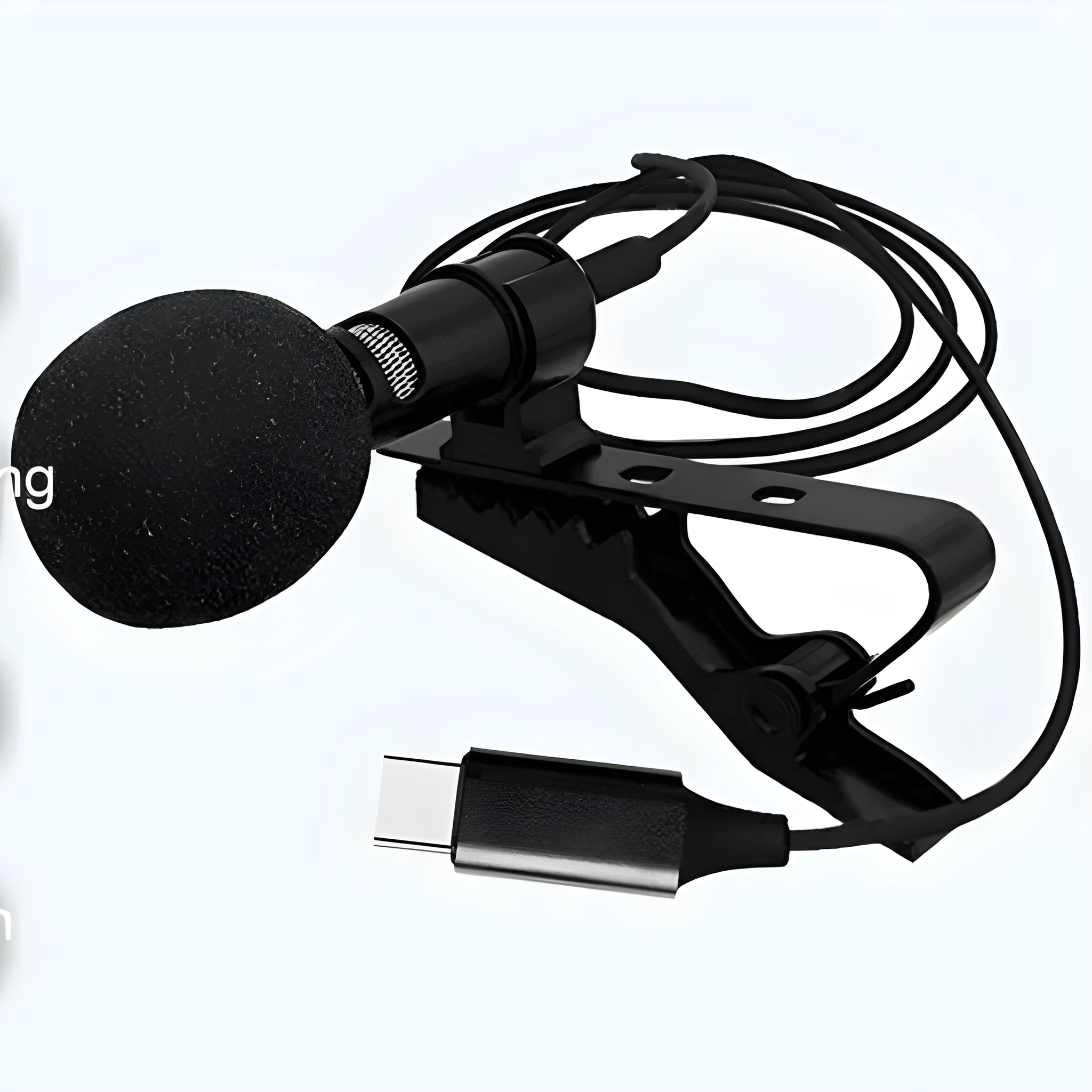 Black USB-C lavalier microphone with metal clip and sponge cover on a table