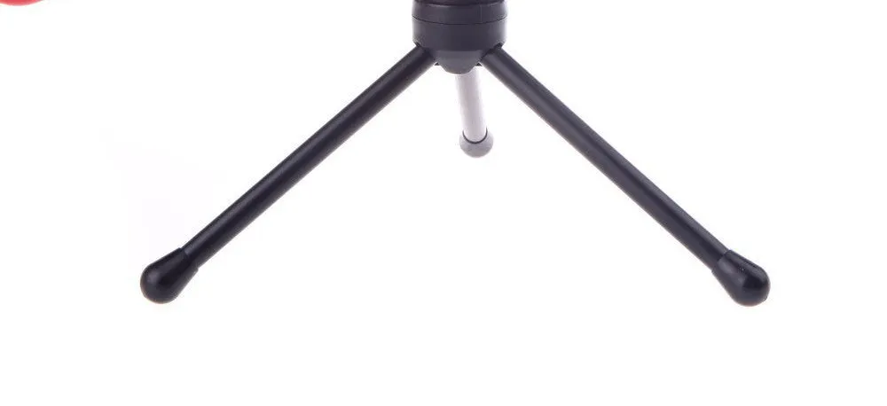 Black wired computer microphone with clothing clip and desk mounting bracket on a white background.