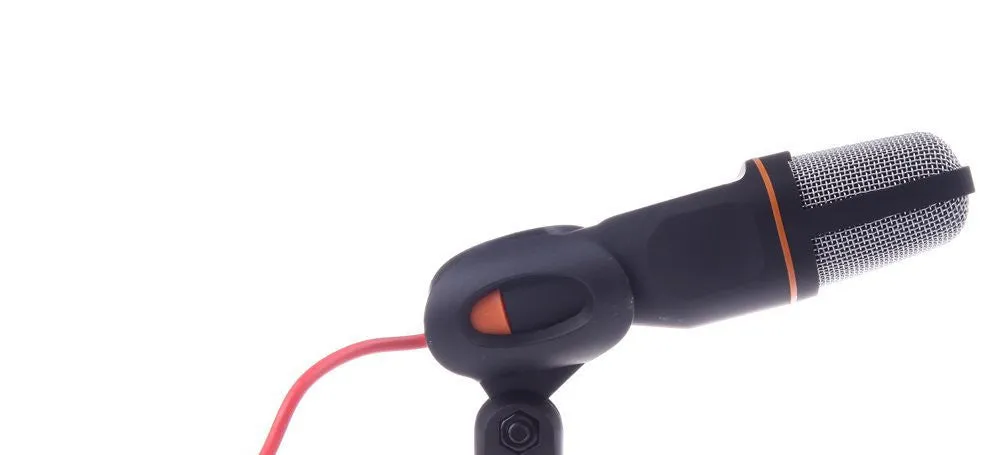 Black wired computer microphone with clothing clip and desk mounting bracket on a white background.