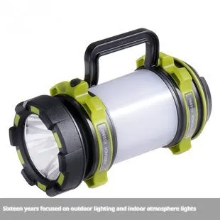Green KS-5992AC portable LED searchlight with 5W headlight and 3W side light on outdoor background