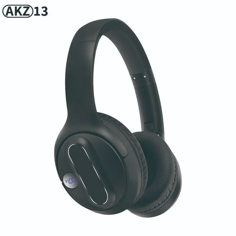 Retro wireless Bluetooth earphones with orange plastic shell, foldable headband, and digital display