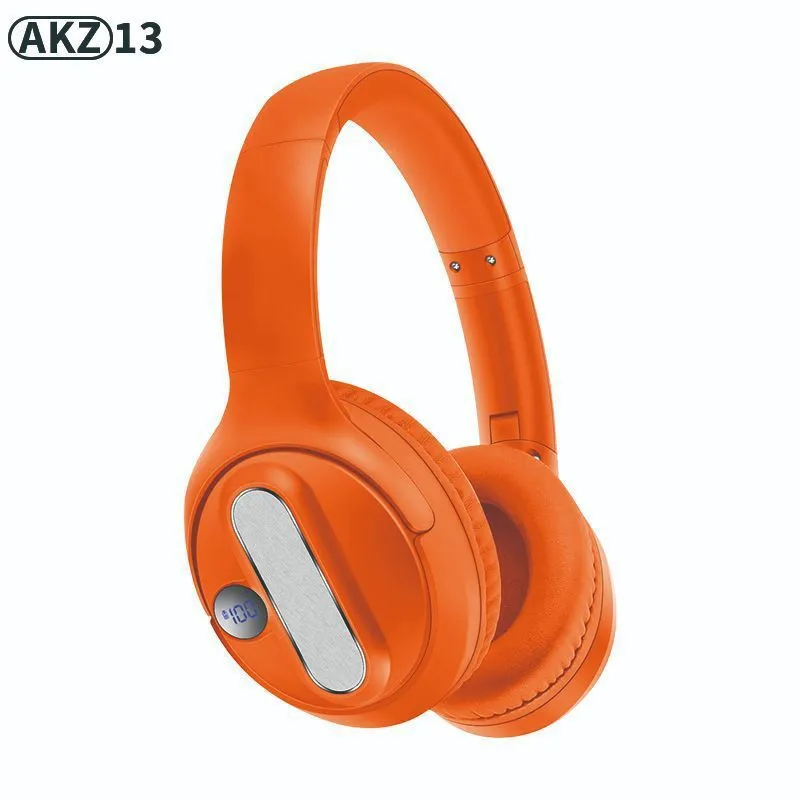 Retro wireless Bluetooth earphones with orange plastic shell, foldable headband, and digital display