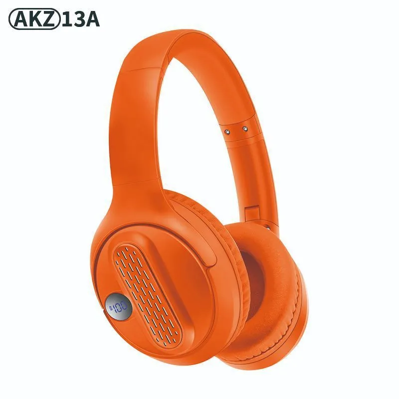 Retro wireless Bluetooth earphones with orange plastic shell, foldable headband, and digital display